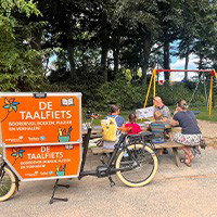De TaalTour-bakfiets rolt je wijk in