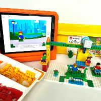 Bouw en programmeer met LEGO Spike Essential – de vrolijke reiziger!
